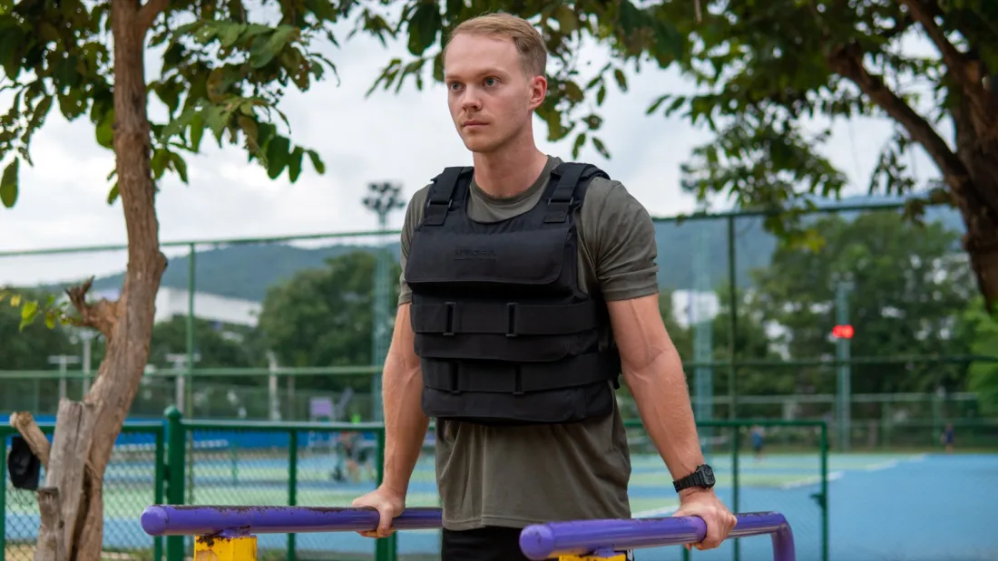 Athlete training on parallel bars in the HydraTech vest